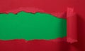 Ripped red paper with green background Royalty Free Stock Photo