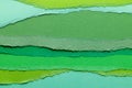 Ripped up pieces of coloured paper with copy space Royalty Free Stock Photo