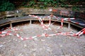 Ripped warning tapes on the benches