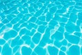 Ripple blue water in swimming pool witn sun reflection Royalty Free Stock Photo