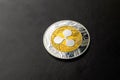 Ripple coin close-up on black background, cryptocurrency business and finance concept, copy space photo