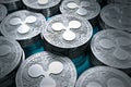 Ripple coins XRP in blurry closeup. New cryptocurrency concept