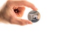 Ripple and cryptocurrency investing concept. Male hand holds silver ripple coin