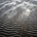 Ripple patterns formed on wet sand, likely from the action of tidal movements Royalty Free Stock Photo