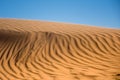 Ripple sand dunes and blue sky background