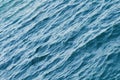Ripple on the surface of the ocean water close-up. Blue sea background with waves. Royalty Free Stock Photo