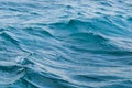 Ripple on the surface of the ocean water close-up. Blue sea background with waves. Royalty Free Stock Photo