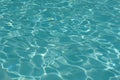 Ripple water surface and sun reflection in swimming pool Royalty Free Stock Photo
