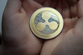 Ripple XRP Coin in a Hands