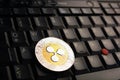 Ripple XRP  coin over a black laptop keyboard Royalty Free Stock Photo