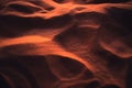 Rippled glowing sand of desert at sunset Royalty Free Stock Photo