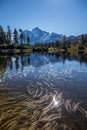 Mount Shuksan and cumulus cloud reflected in rippled Mirror Lake Royalty Free Stock Photo