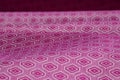 Rippled purple patterned ethnic fabric background