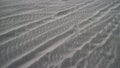 rippled sand on a beach with diagonal patterns Royalty Free Stock Photo