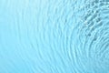 Rippled surface of clear water on light blue background, top view Royalty Free Stock Photo