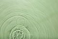 Rippled surface of clear water on light green background, top view Royalty Free Stock Photo