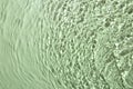 Rippled surface of clear water on light green background, top view Royalty Free Stock Photo