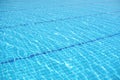 Rippled surface of Swimming pool blue water sun reflecting sleek background Royalty Free Stock Photo