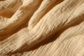 Rippled thin beige cotton muslin fabric