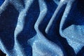 Rippled thin shiny blue lurex fabric Royalty Free Stock Photo