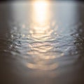 Of rippled water capturing the shimmering reflection of light on its Royalty Free Stock Photo