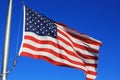 Rippled waving usa flag in the blue sky at day time Royalty Free Stock Photo