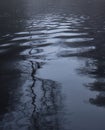 Ripples in blue lake water in German pond Royalty Free Stock Photo