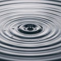 Ripples emanate from a central droplet Royalty Free Stock Photo