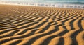 Ripples in the golden sand stretch towards the shoreline, capturing the texture and pattern of a Royalty Free Stock Photo