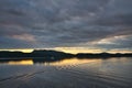 The ripples left by the cruise ship sailing across the lake. Tranquil beauty. Royalty Free Stock Photo