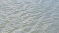 Ripples in light blue water background Royalty Free Stock Photo