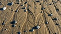 Ripples of sand form intricate patterns on a beach, interspe Royalty Free Stock Photo