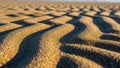 Ripples in the sand likely formed by wind or water create a wavy Royalty Free Stock Photo