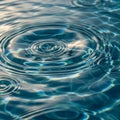 Ripples spread across a tranquil water surface creating circular Royalty Free Stock Photo