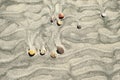 Ripples and stones in sand on beach Royalty Free Stock Photo