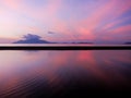 Sunset ripples, beautiful pink and purple sunset reflecting in shallow tide pool