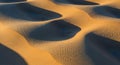 Rippling sand dunes create a stunning pattern with alternating light and shadow in a desert Royalty Free Stock Photo