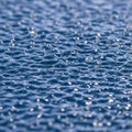 Rippling water surface with small, uniform waves, creating a textured pattern Royalty Free Stock Photo