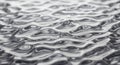 Ripppling water surface displays an abstract pattern. Light and shadow interplay on the wavelets, Royalty Free Stock Photo