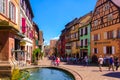 Riquewihr, France-June 23, 2016: Tourists are walking on the main shopping street in Riquewihr Royalty Free Stock Photo