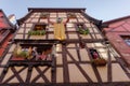 Facade of half timbered houses in Riquewihr village, France Royalty Free Stock Photo