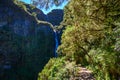 Risco Waterfall - Hiking on Levada trail 25 Fontes in Laurel forest at Rabacal - beautiful landscape scenery - Madeira Island,