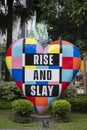 Rise and slay word on love shape banner it Bonifacio High Street, Manila