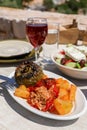 Rise stuffed fresh tomato and pepper in greek tavern. Royalty Free Stock Photo