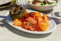 Rise stuffed fresh tomato and pepper in greek tavern. Royalty Free Stock Photo