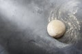 Risen or proved yeast dough for bread or pizza on a floured slate surface Royalty Free Stock Photo