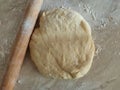 Risen or Proved Yeast Dough with Rolling Pin top view. Dough and Flour. Royalty Free Stock Photo