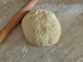 Risen or Proved Yeast Dough with Rolling Pin top view. Dough and Flour. Royalty Free Stock Photo