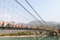 Bridge over Ganga river, Ram Jhula, Rishikesh. People crossing Ram Jhula bridge Royalty Free Stock Photo