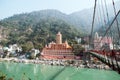 Rishikesh India. 10 January 2018. Beautiful view of Ganga river embankment, Lakshman Jhula bridge and Tera Manzil Temple, Trayamba Royalty Free Stock Photo